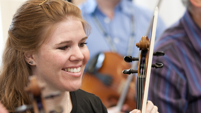 Young violinist laughing Young violinist laughing