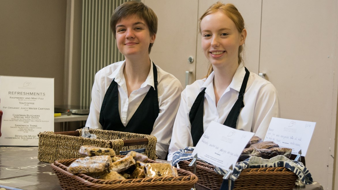 undefinedCasual staff manning the refreshment stall smiling