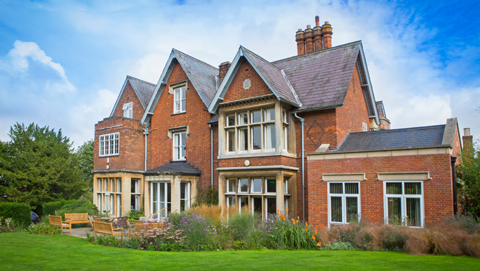 undefinedBenslow Music house and gardens with blue sky